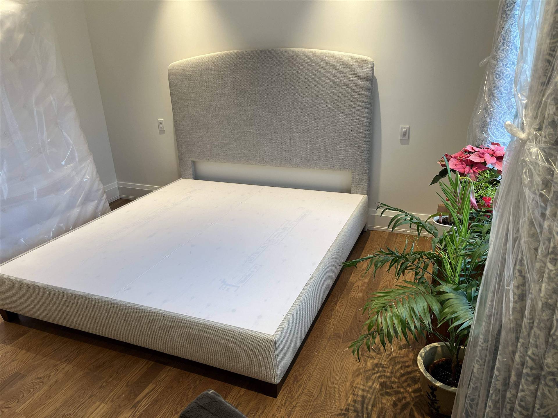 Arched linen platform bed