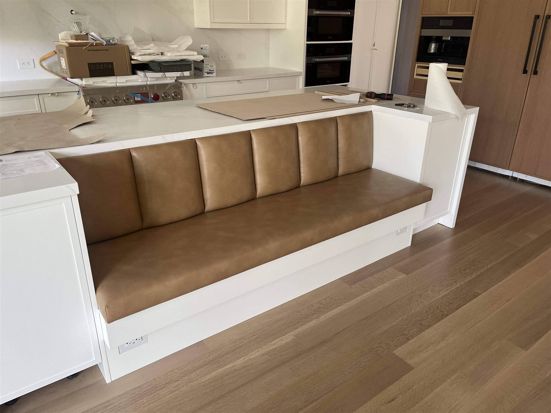 Tan leather island banquette
