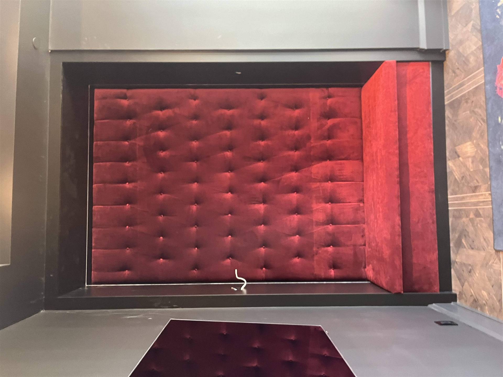 Red velvet tufted wall piece